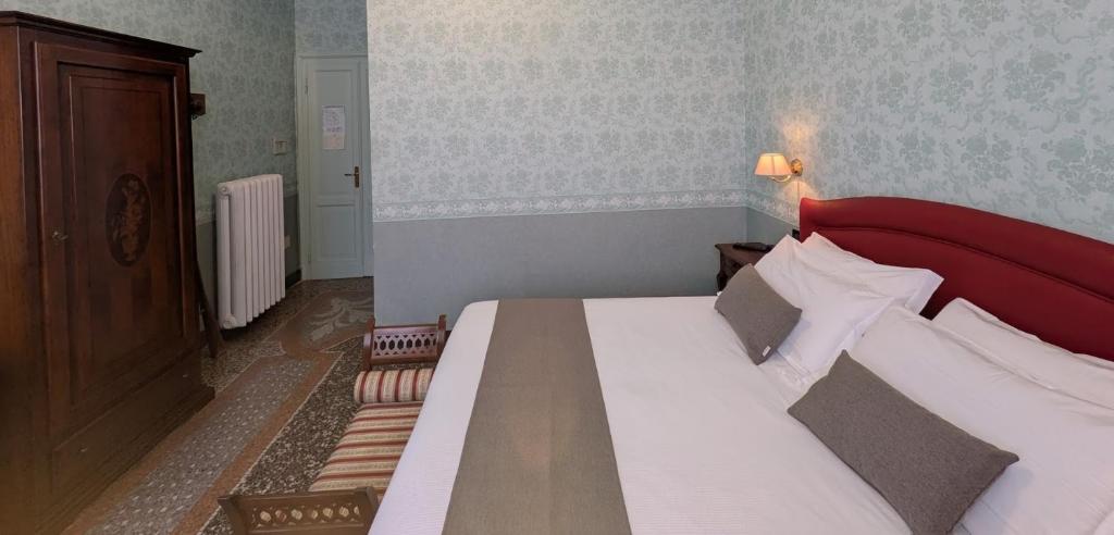 Postel nebo postele na pokoji v ubytování Villa Fieschi Boutique Hotel