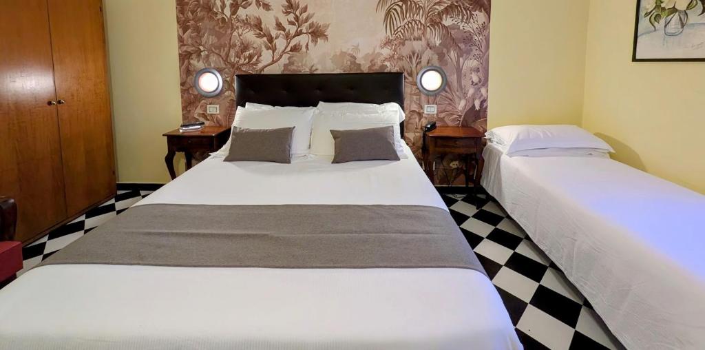 Postel nebo postele na pokoji v ubytování Villa Fieschi Boutique Hotel