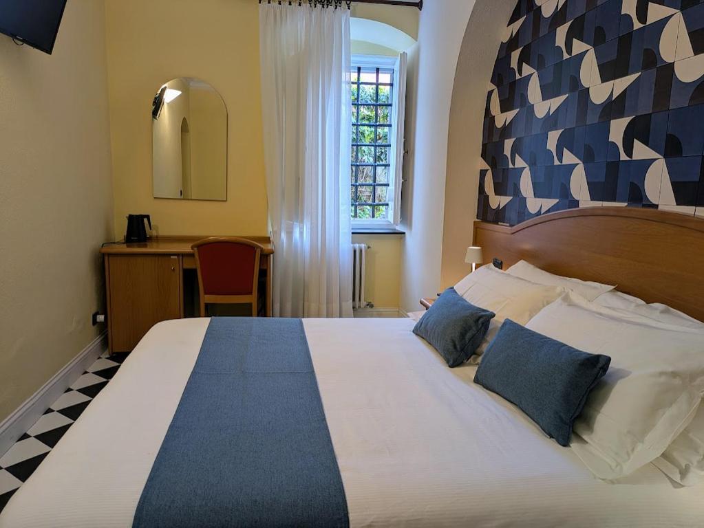 Postel nebo postele na pokoji v ubytování Villa Fieschi Boutique Hotel