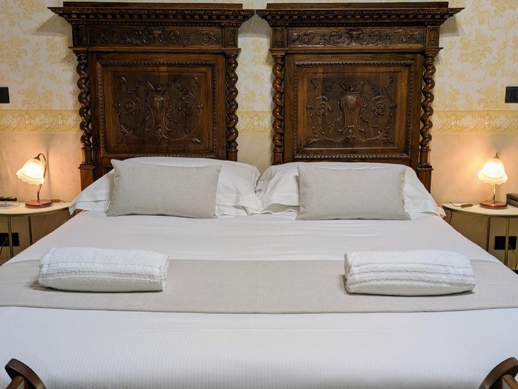 Postel nebo postele na pokoji v ubytování Villa Fieschi Boutique Hotel
