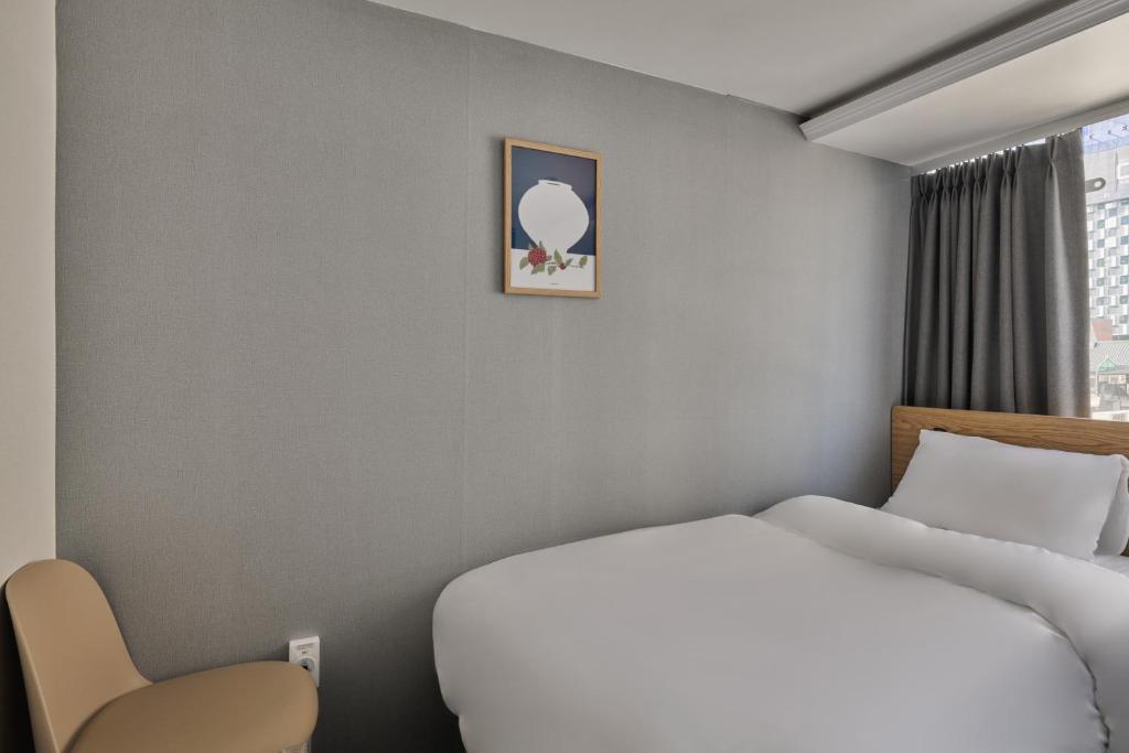 Postel nebo postele na pokoji v ubytování L hostel