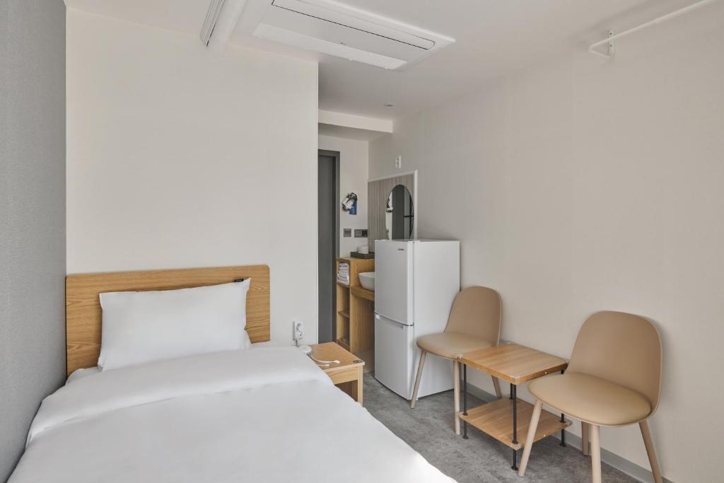 Postel nebo postele na pokoji v ubytování L hostel