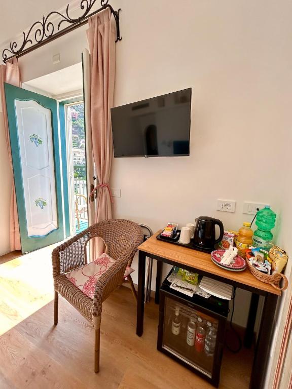 TV a/nebo společenská místnost v ubytování Casa Cosenza