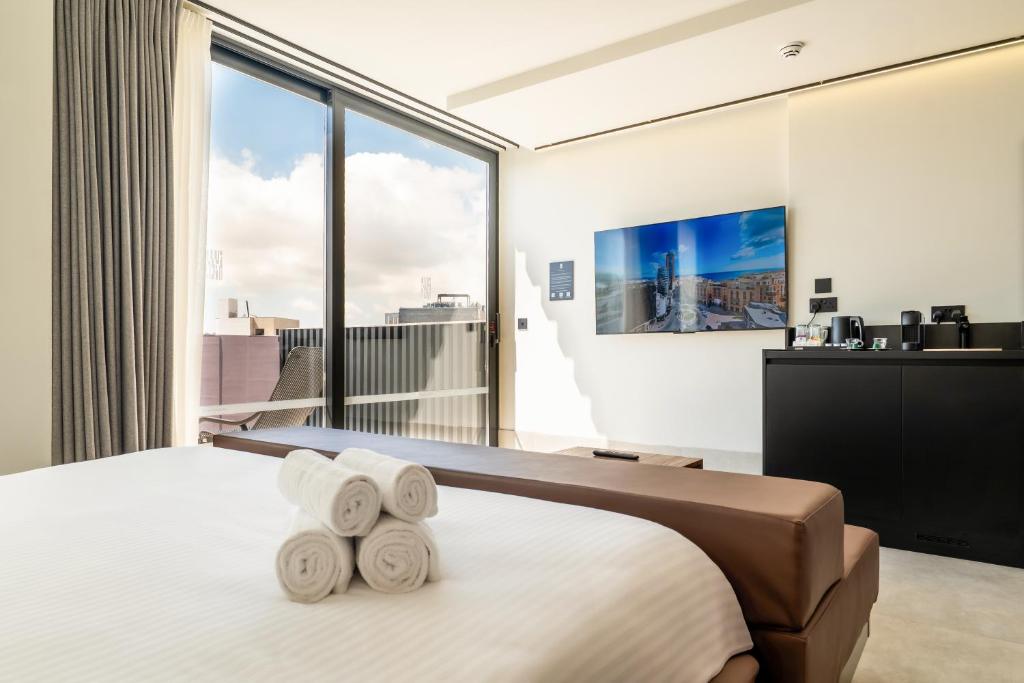 TV a/nebo společenská místnost v ubytování Onyx Hotel