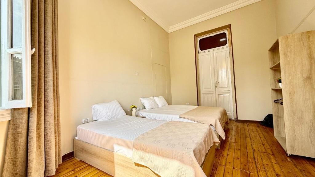 Postel nebo postele na pokoji v ubytování La Bella Casa Hostel