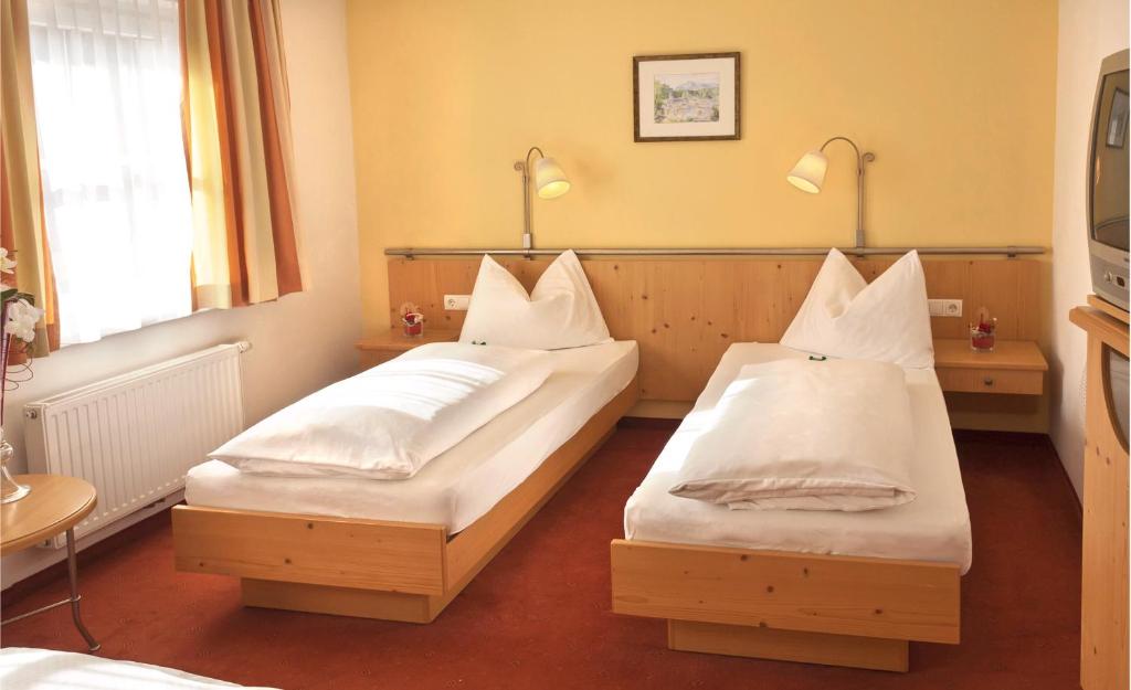 Postel nebo postele na pokoji v ubytování Hotel Kohlpeter