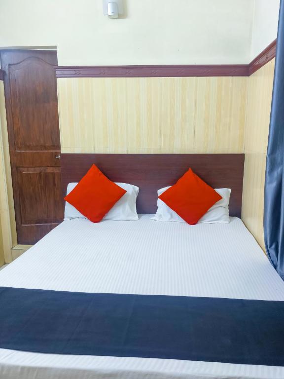 Postel nebo postele na pokoji v ubytování New AS Tourist Home Aluva