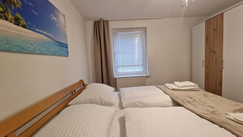 Postel nebo postele na pokoji v ubytování homy Bludenz Downtown Suites