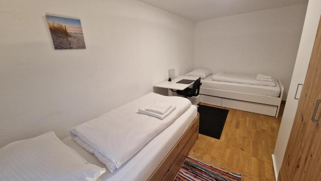 Postel nebo postele na pokoji v ubytování homy Bludenz Downtown Suites