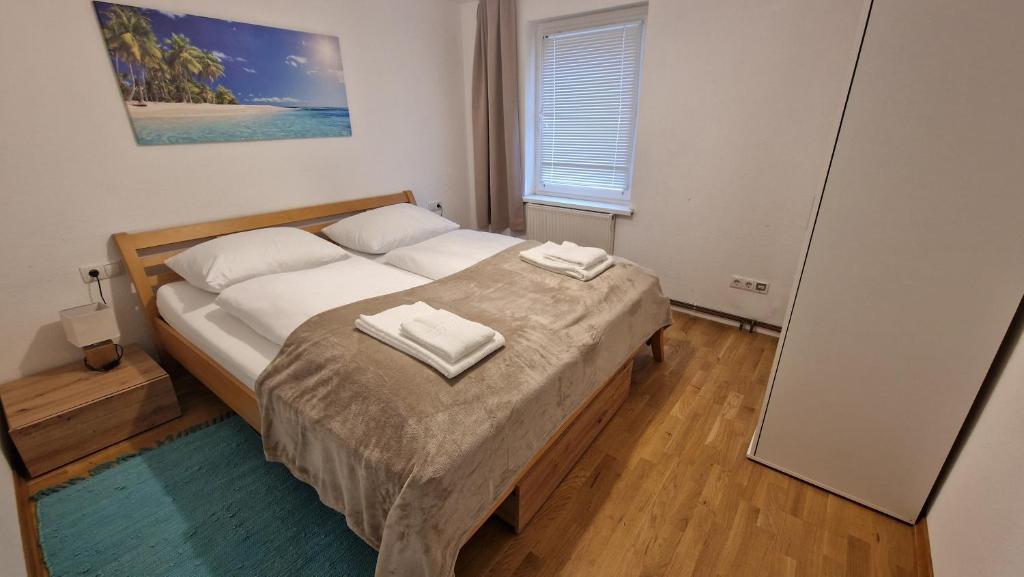 Postel nebo postele na pokoji v ubytování homy Bludenz Downtown Suites