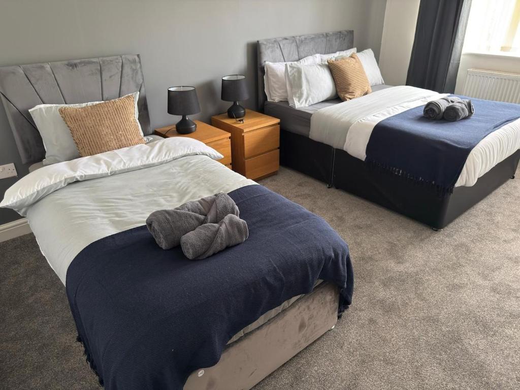 a bedroom with two beds with stuffed animals on them at Sunderland Castle Free Parking in Sunderland