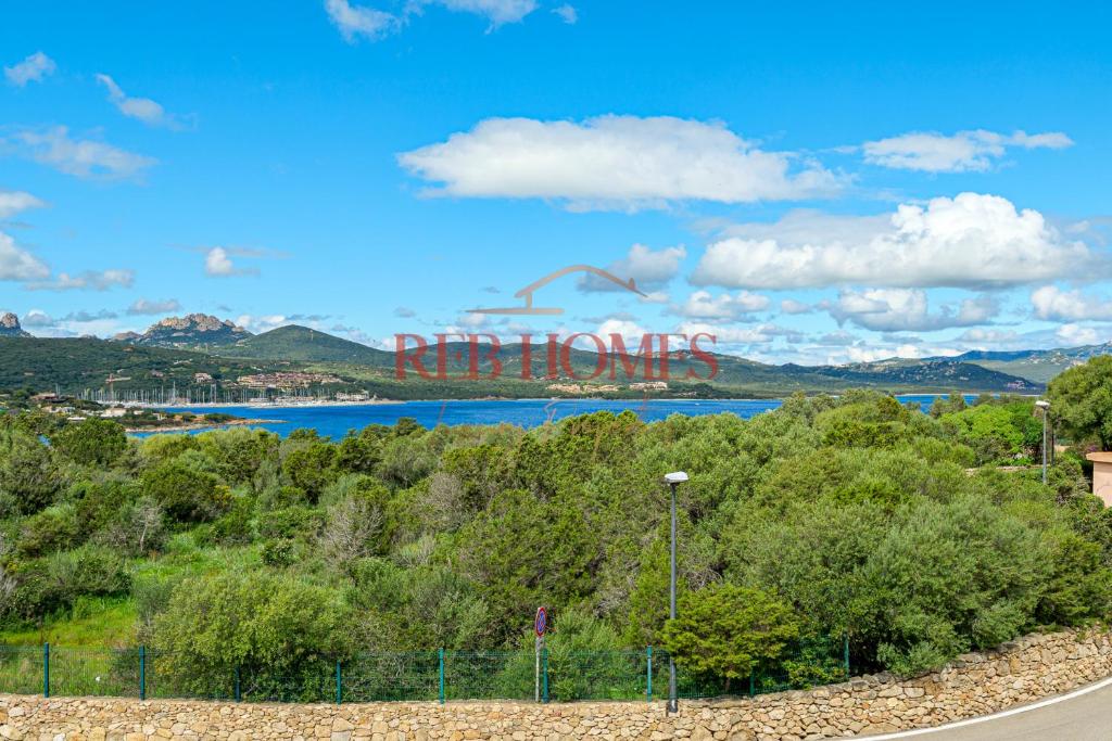 a view of a river with a sign that says detroit at La Bouganville in Porto Rotondo