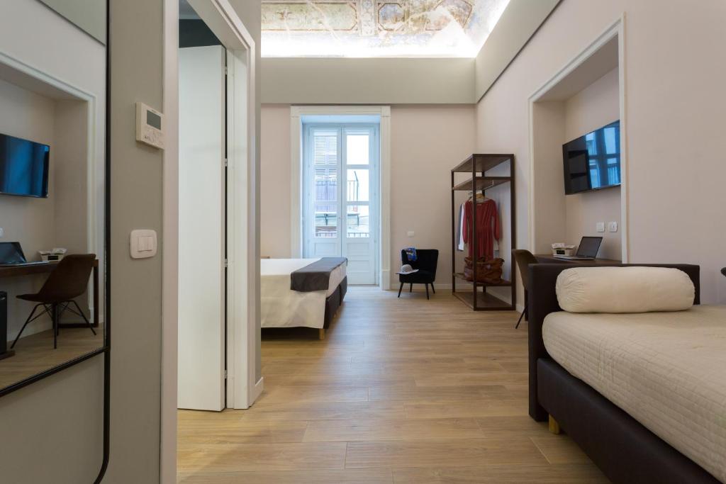 Una cama o camas en una habitación de Bellaroto Suite & SPA