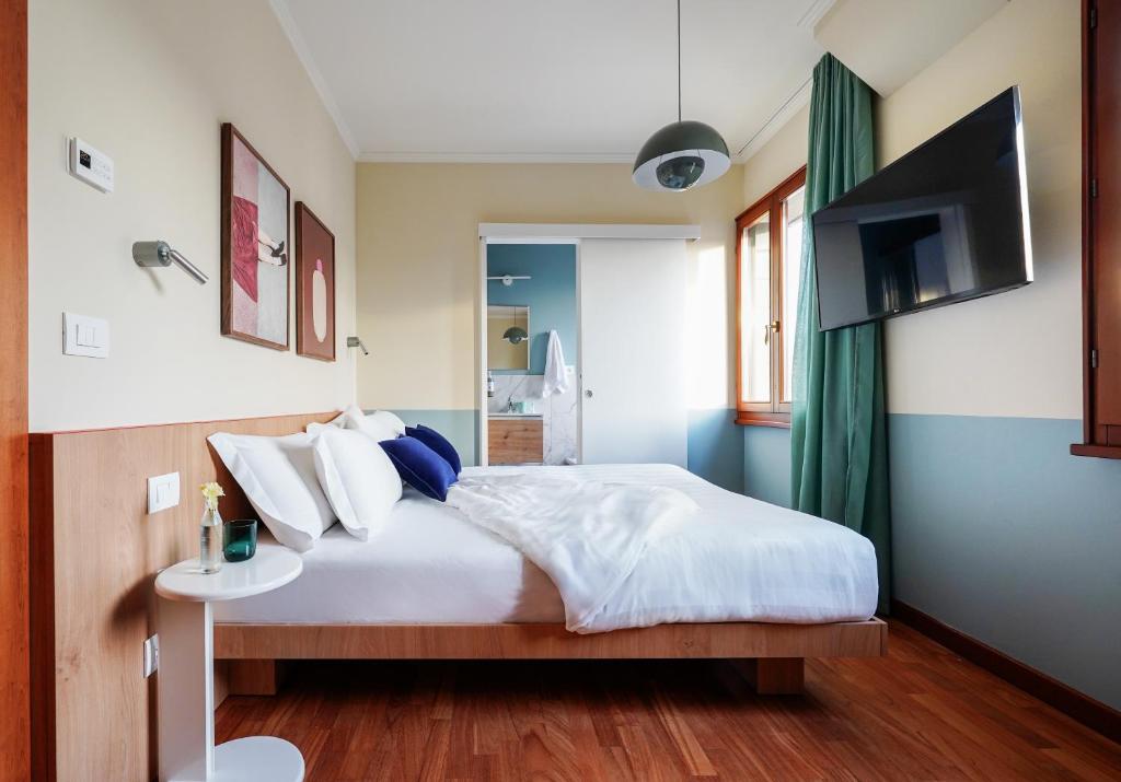 Postel nebo postele na pokoji v ubytování Numa Venice Forcola