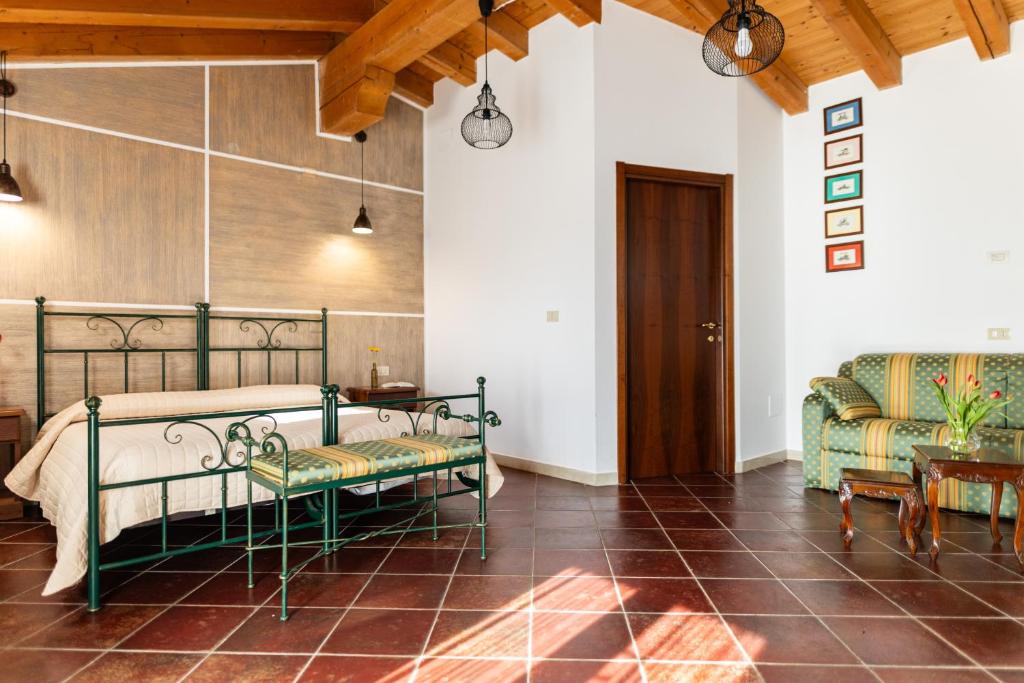 Postel nebo postele na pokoji v ubytování Agriturismo San Bartolomeo