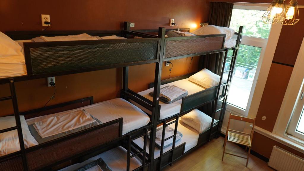 Ein Bett oder Betten in einem Zimmer der Unterkunft Onefam Amstel