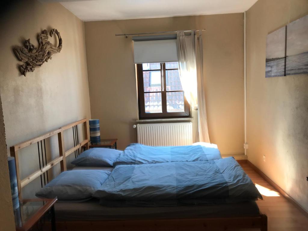 Postel nebo postele na pokoji v ubytování L'Ancienne Distillerie
