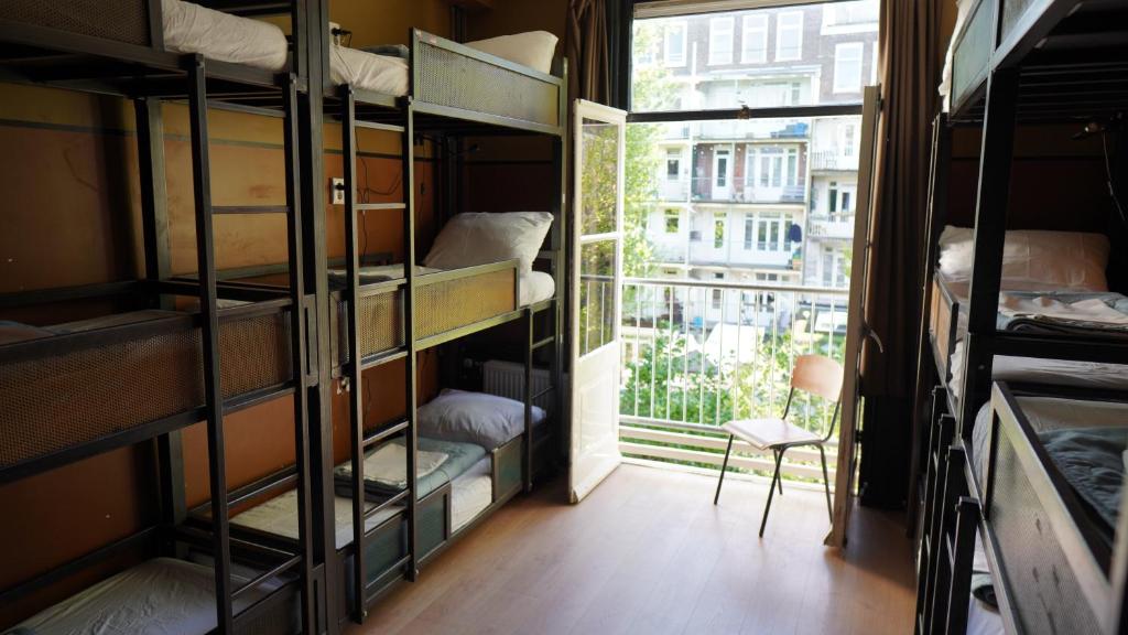 Ein Bett oder Betten in einem Zimmer der Unterkunft Onefam Amstel