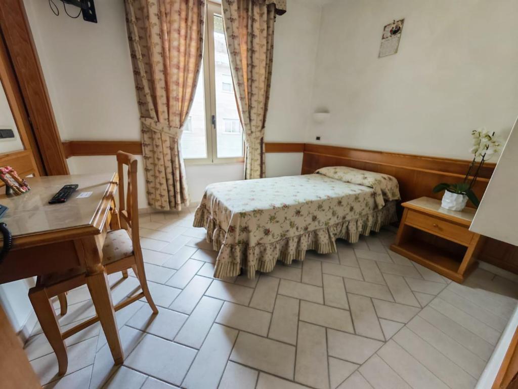 Postel nebo postele na pokoji v ubytování Hotel Pace