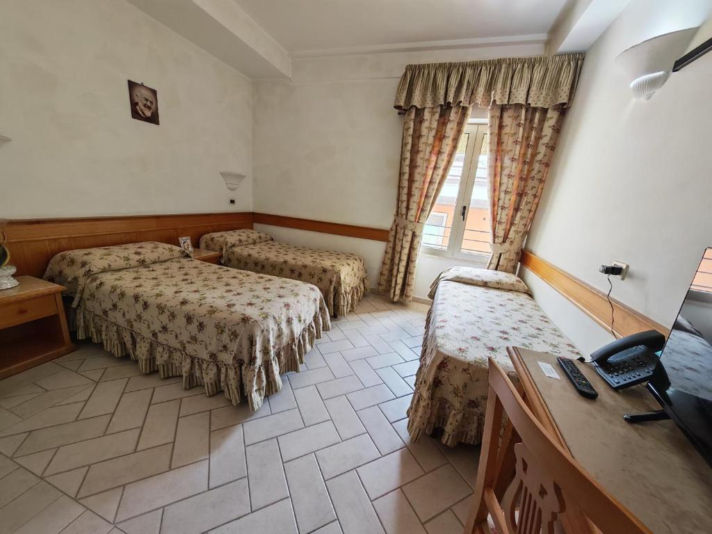 Postel nebo postele na pokoji v ubytování Hotel Pace