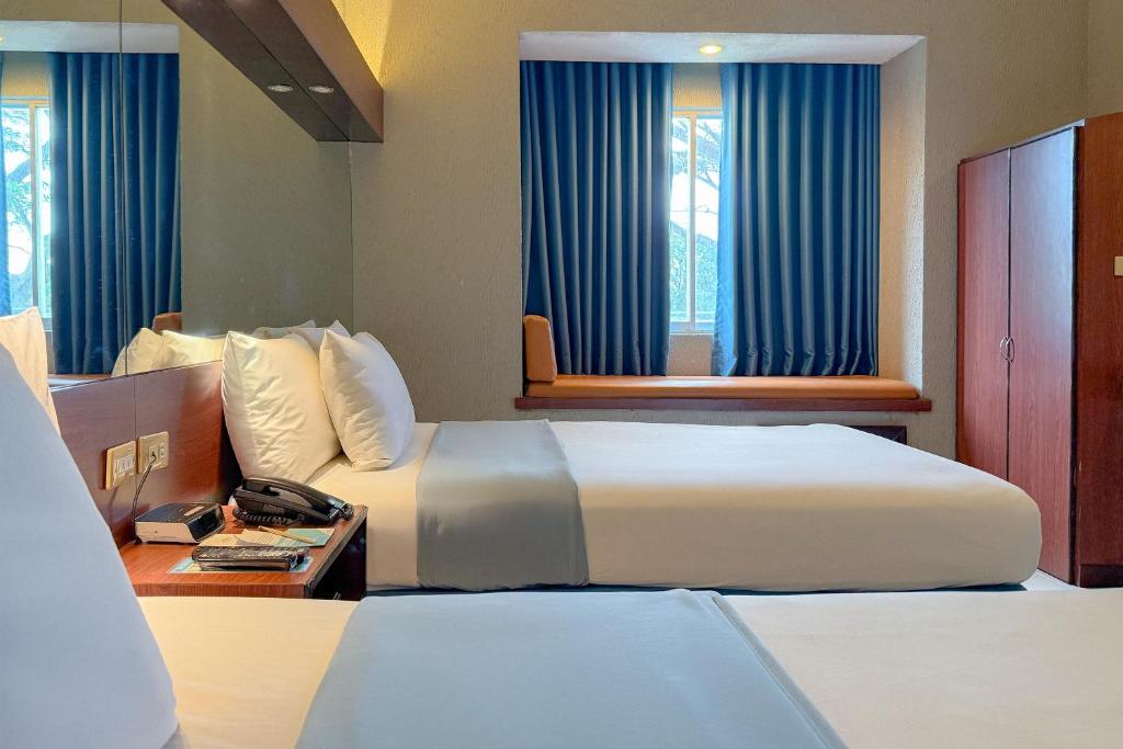 Postel nebo postele na pokoji v ubytování Microtel by Wyndham Eagle Ridge