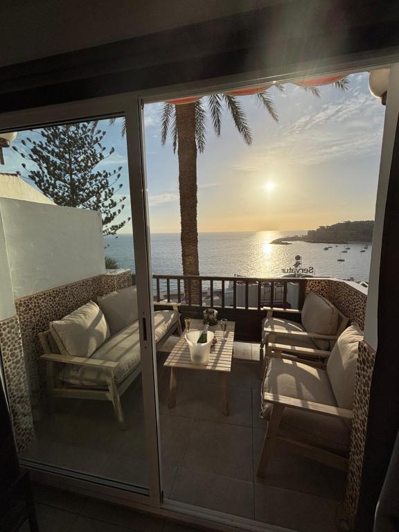 a balcony with a view of the ocean at Vistamar in Patalavaca