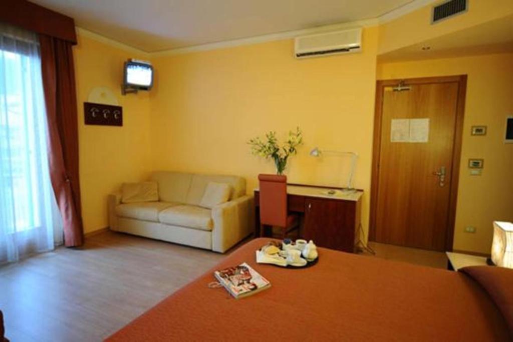 Postel nebo postele na pokoji v ubytování Hotel Al Sole - ENJOY HOLIDAY