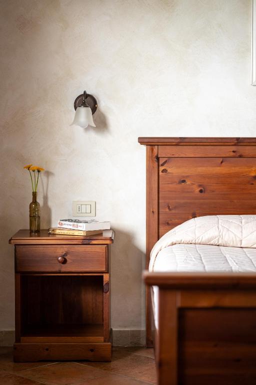 Postel nebo postele na pokoji v ubytování Agriturismo San Bartolomeo