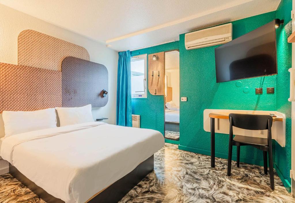 Postel nebo postele na pokoji v ubytování B&B HOTEL Strasbourg Nord Schiltigheim