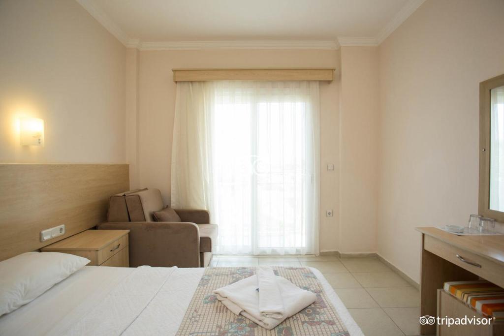 Postel nebo postele na pokoji v ubytování Viras Hotel