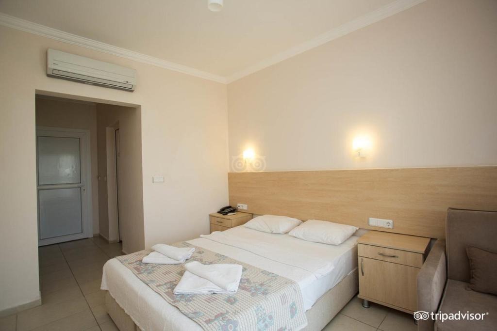 Postel nebo postele na pokoji v ubytování Viras Hotel