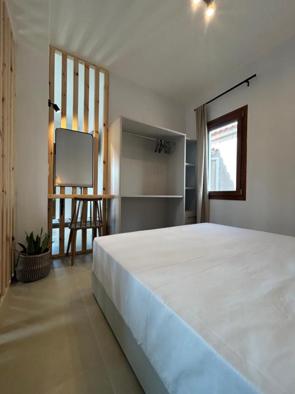 Postel nebo postele na pokoji v ubytování KYNTHIA seaview apartments samos