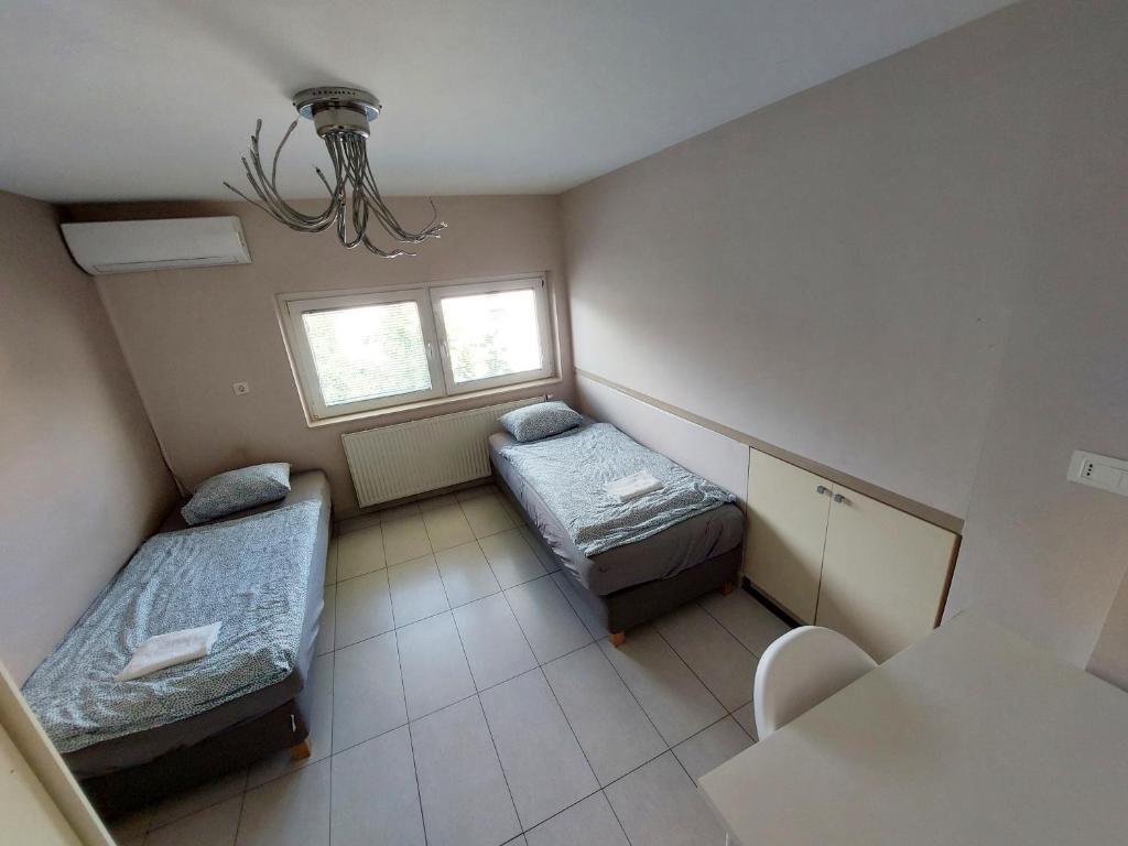 Postel nebo postele na pokoji v ubytování GFS way studios - greenline accomodation