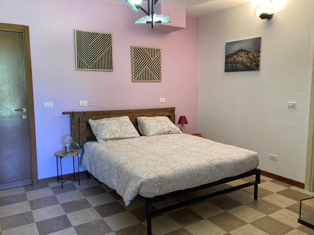 Postel nebo postele na pokoji v ubytování Villa Vinea Prisca B&B