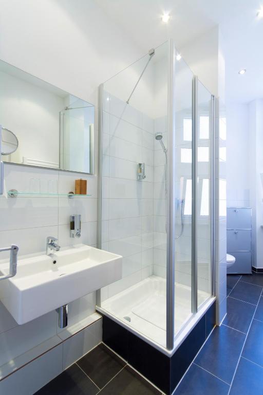 Koupelna v ubytování Qube Hotel Bergheim