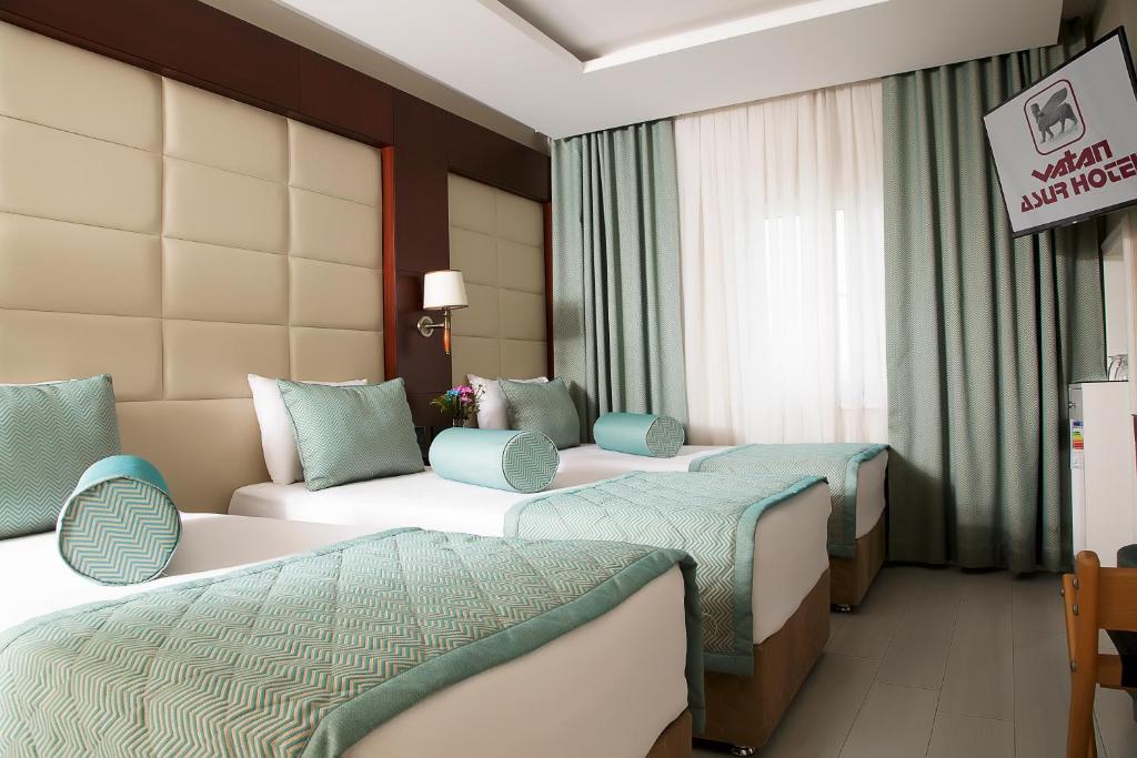 Postel nebo postele na pokoji v ubytování Vatan Asur Hotel