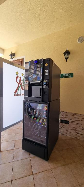 a video game machine sitting on the floor in a room at Room & Breakfast Aloe in San Vito lo Capo