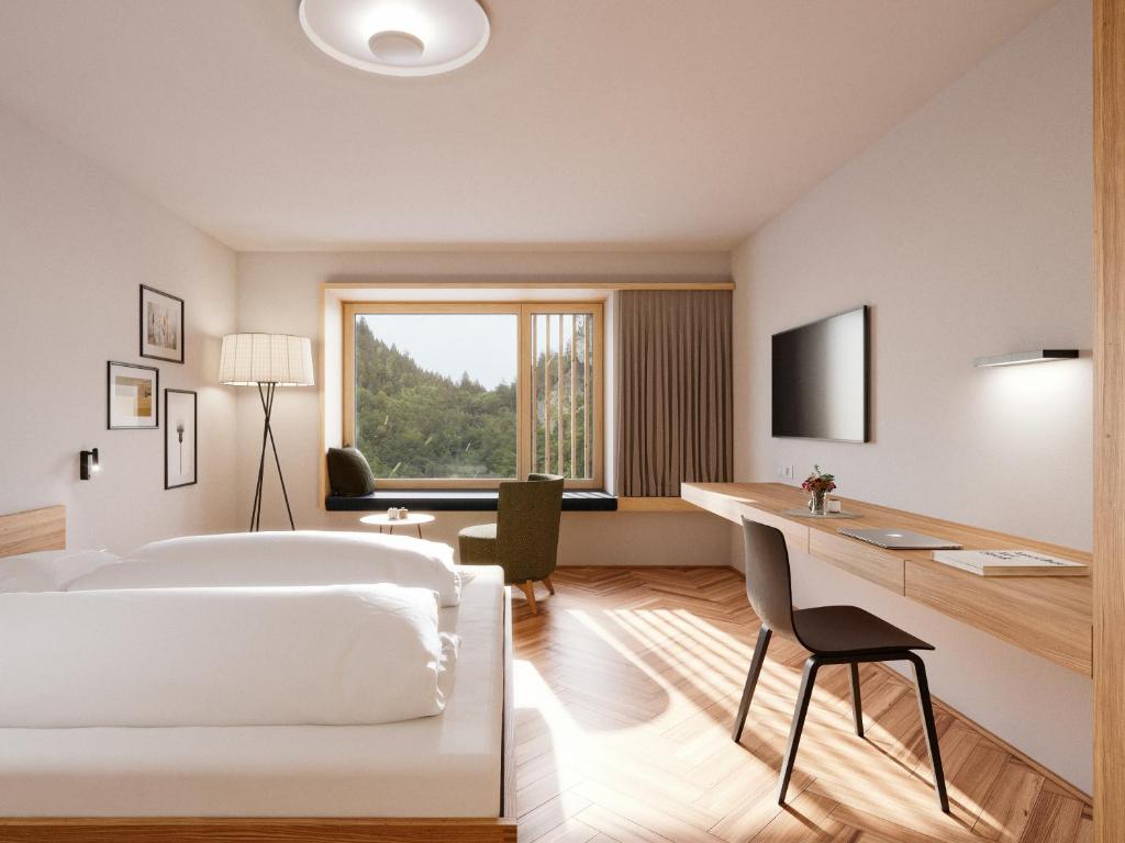 Televízia a/alebo spoločenská miestnosť v ubytovaní Hotel Krone in Au