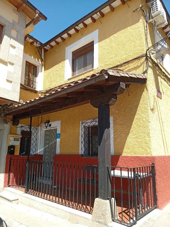 a colorful house with a fence in front of it at Tío Abraham in El Raso