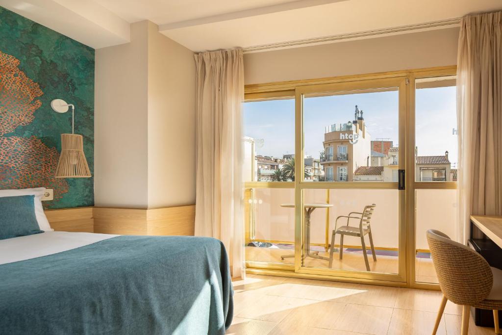 Postel nebo postele na pokoji v ubytování htop Amaika & SPA 4Sup - Adults Only #htopBliss