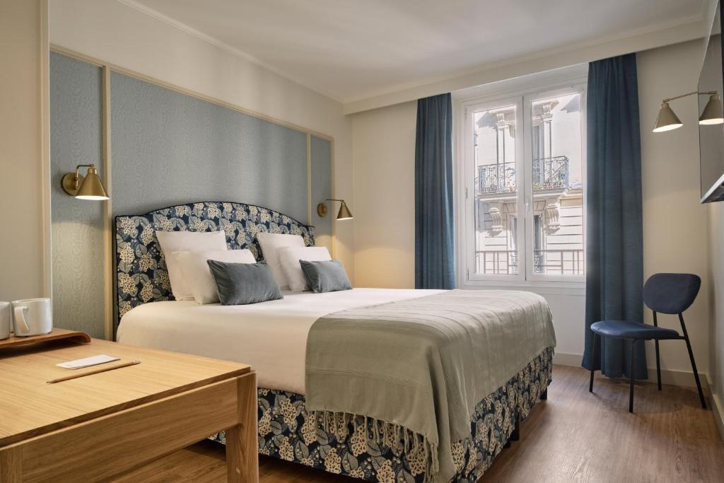 Postel nebo postele na pokoji v ubytování Hotel Etoile Saint Ferdinand by Happyculture