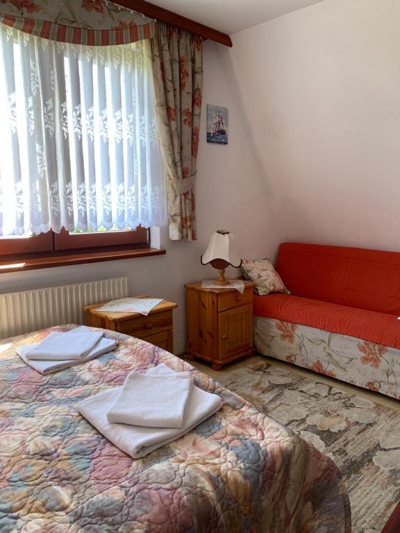 Postel nebo postele na pokoji v ubytování Pokoje u Zofii