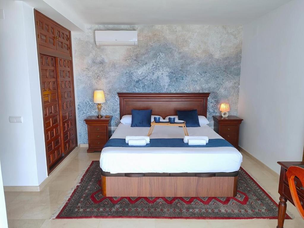 Postel nebo postele na pokoji v ubytování Evans Realty AF Villa de lujo & Piscina & Parking