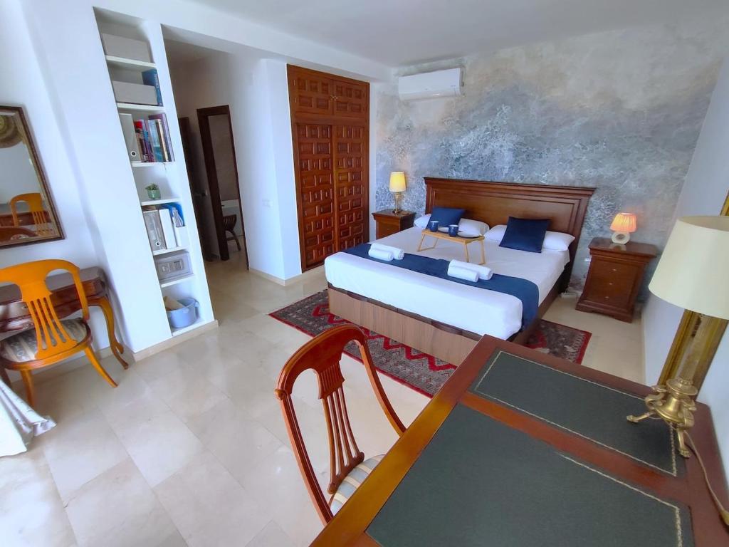 Postel nebo postele na pokoji v ubytování Evans Realty AF Villa de lujo & Piscina & Parking