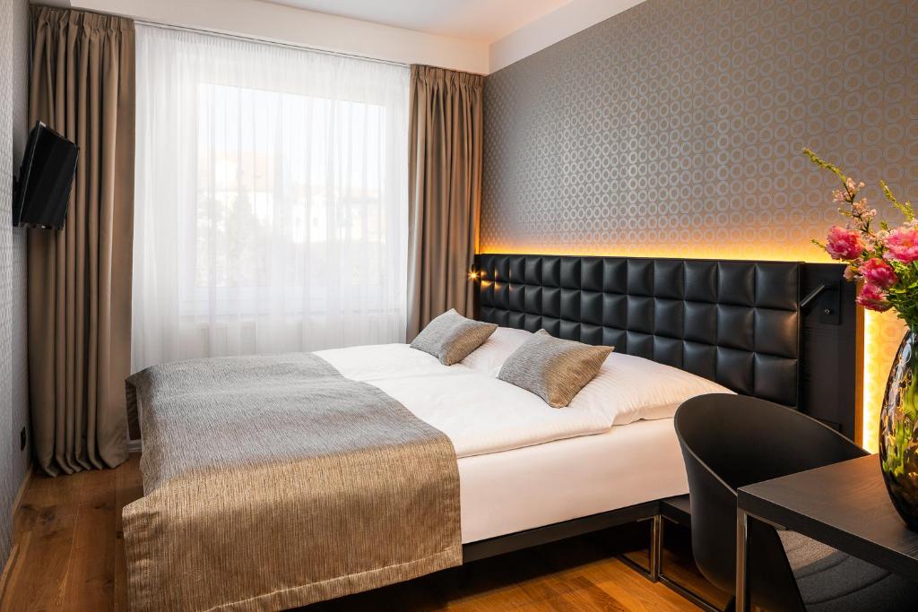 Postel nebo postele na pokoji v ubytování Hotel Aida