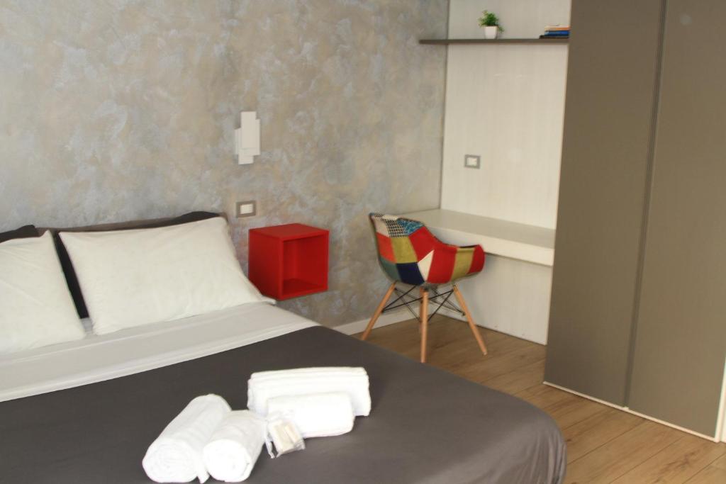 Posteľ alebo postele v izbe v ubytovaní san rocco apartments