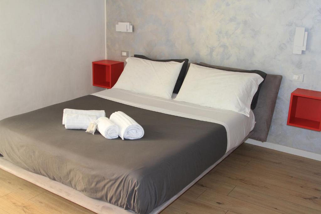 Posteľ alebo postele v izbe v ubytovaní san rocco apartments
