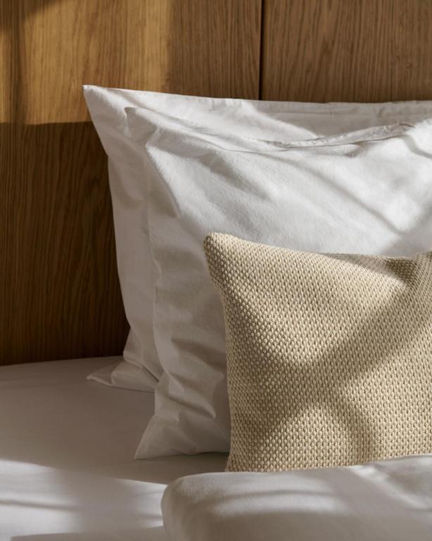 Postel nebo postele na pokoji v ubytování Hotel Petra