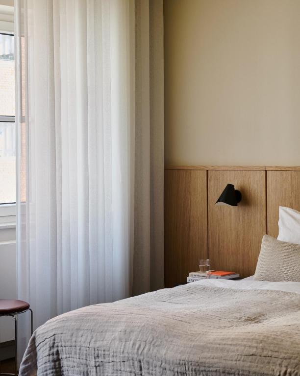 Postel nebo postele na pokoji v ubytování Hotel Petra