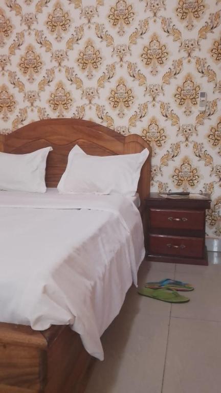 Postel nebo postele na pokoji v ubytování Hotel Lile John